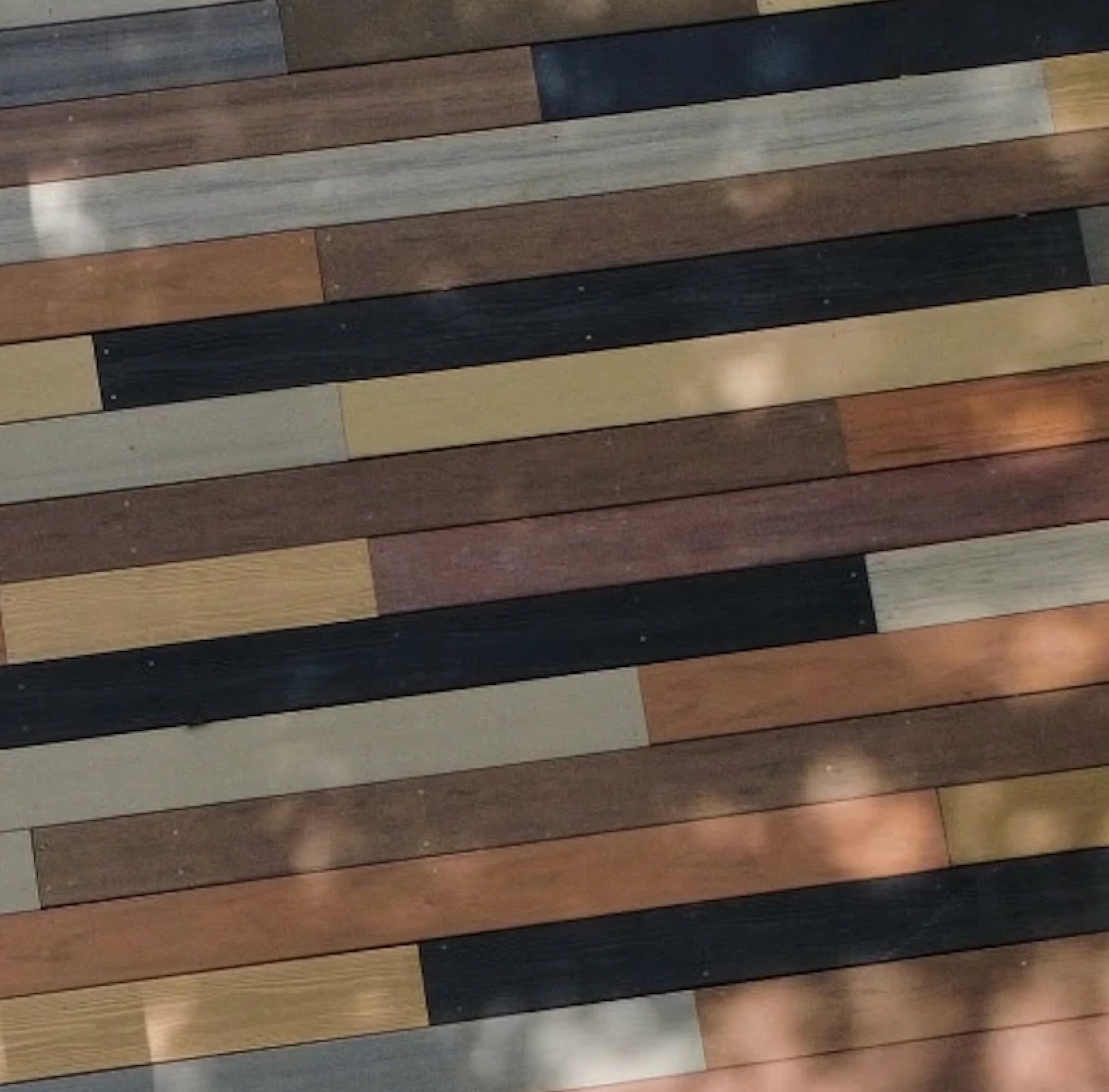 Close-up of deck boards in a patchwork of many composite colors